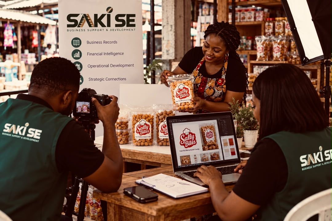 SAKI SE team photographing a snack brand's new packaging at a market stall